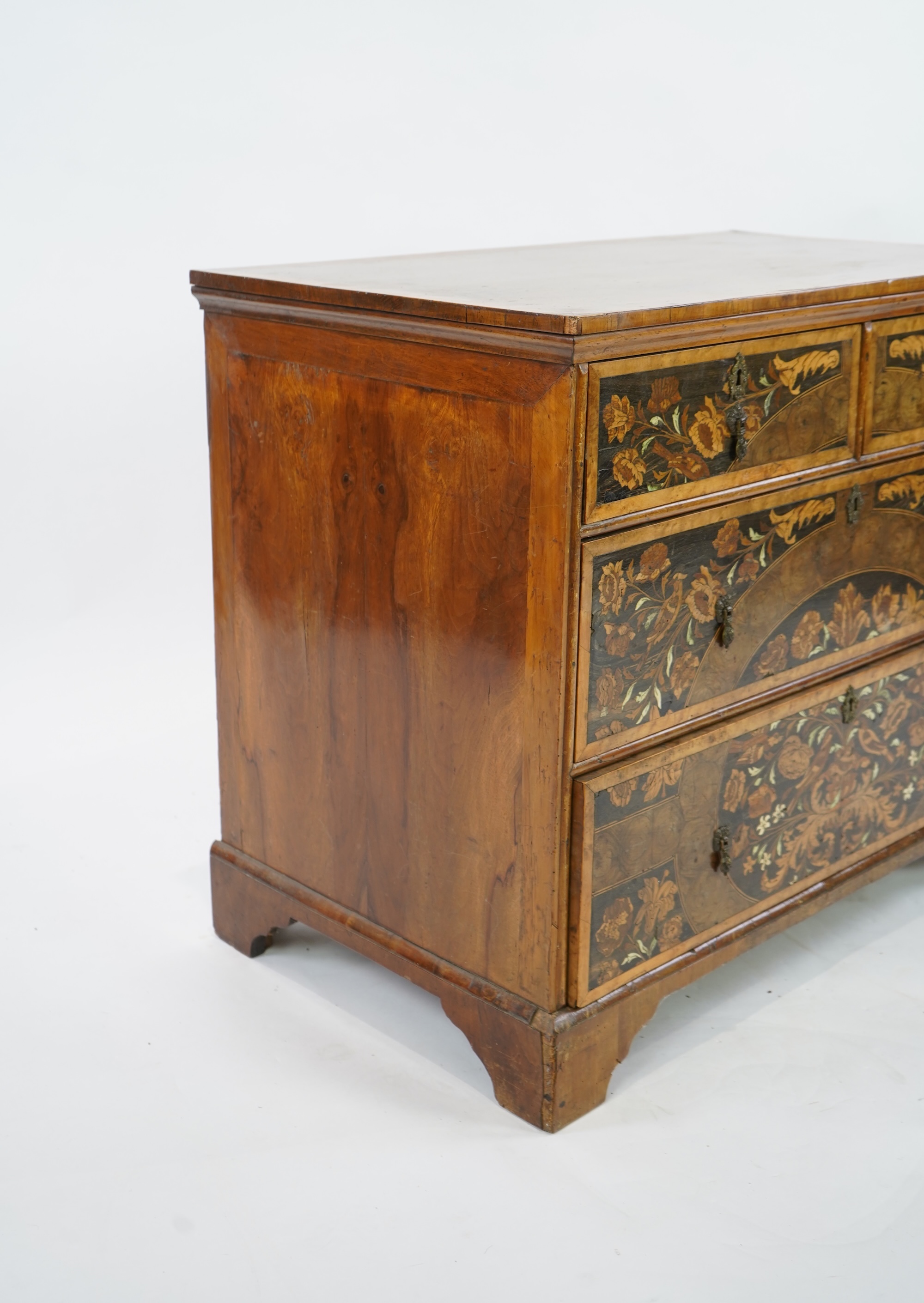A William & Mary and later floral marquetry inlaid walnut chest